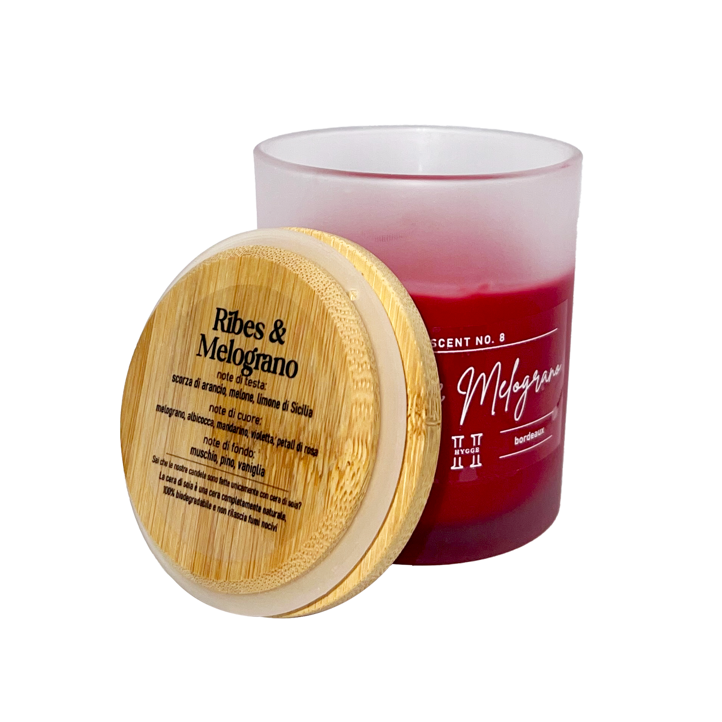 candela profumata bordeaux al profumo di ribes e melograno, dettaglio del tappo in legno con descrizione note olfattive
